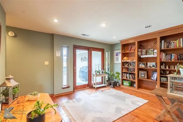 a bedroom with a large bed and a large window