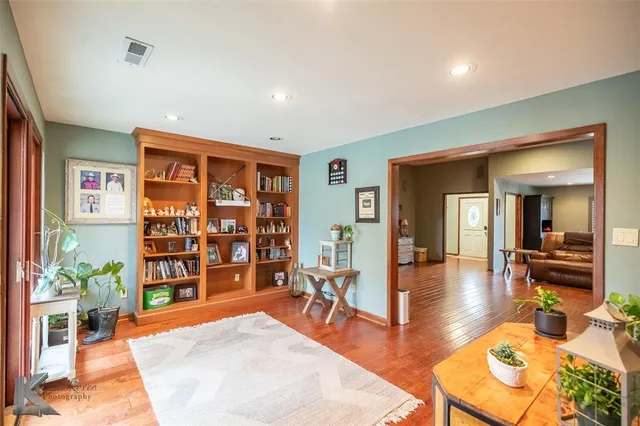 a lobby with furniture and book shelf