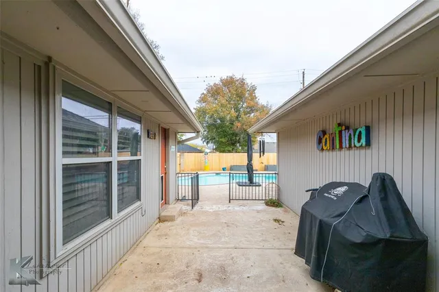 a view of roof deck with furniture and garden