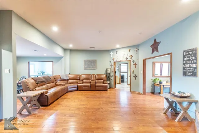 a living room with furniture window and wooden floor