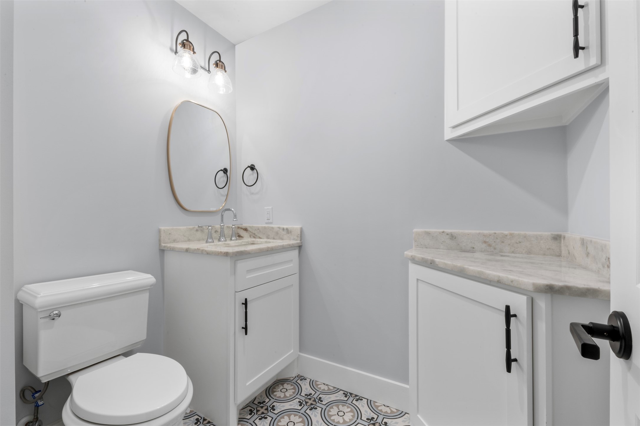 1723 Albans Road Houston, TX 77005 - Photo 13 of 50 a bathroom with a granite countertop toilet sink and mirror