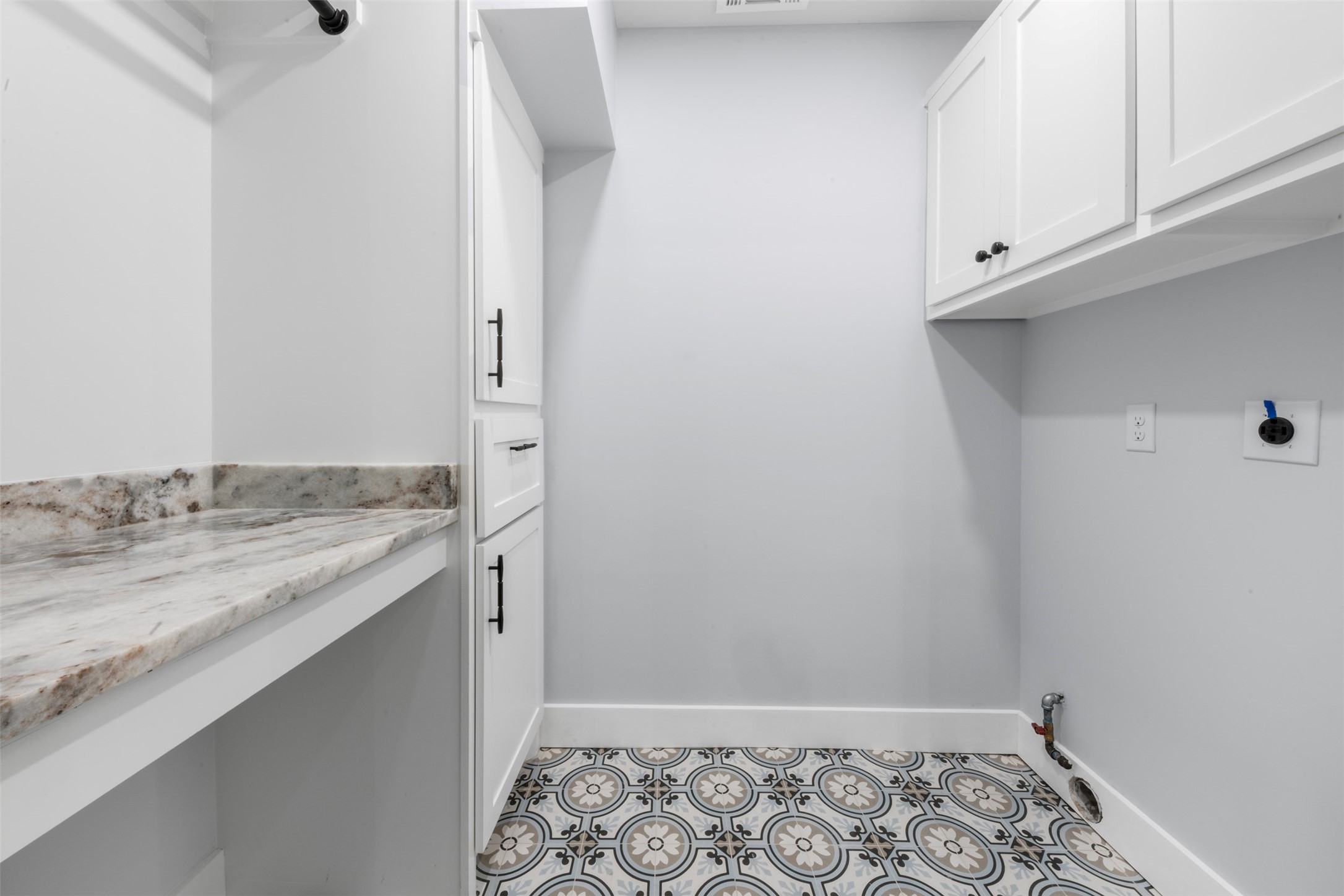 1723 Albans Road Houston, TX 77005 - Photo 14 of 50 a bathroom with a granite countertop sink and white cabinets