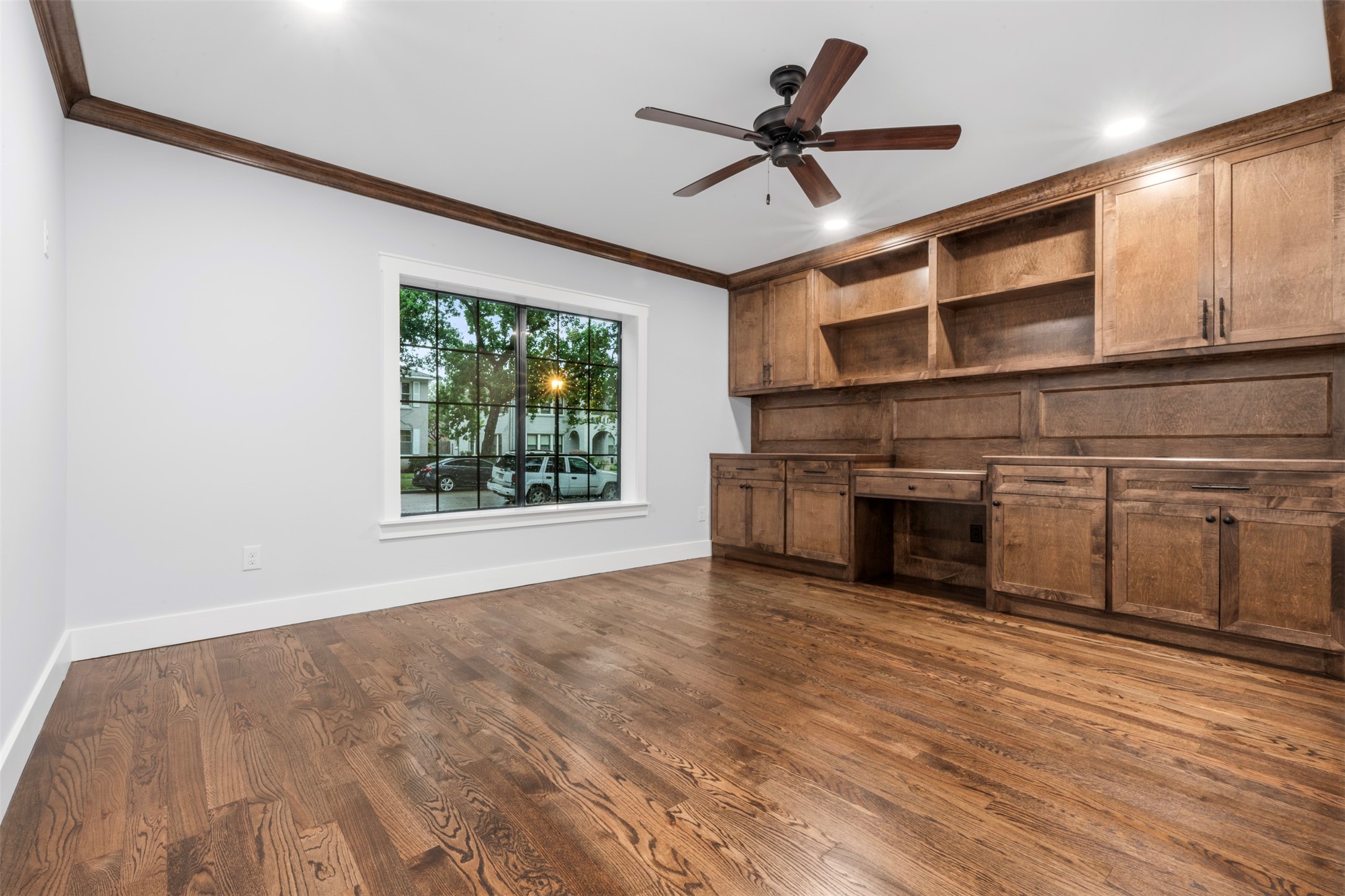 1723 Albans Road Houston, TX 77005 - Photo 16 of 50 a view of a livingroom with a flat screen tv ceiling fan and window