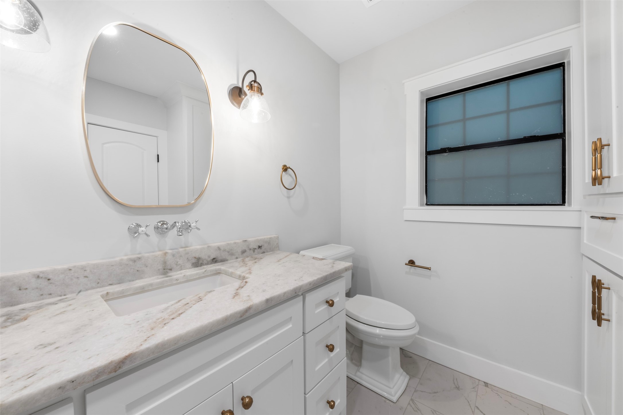 1723 Albans Road Houston, TX 77005 - Photo 20 of 50 a bathroom with a toilet a sink and mirror