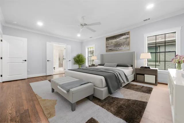 a spacious bedroom with a large bed and a couch