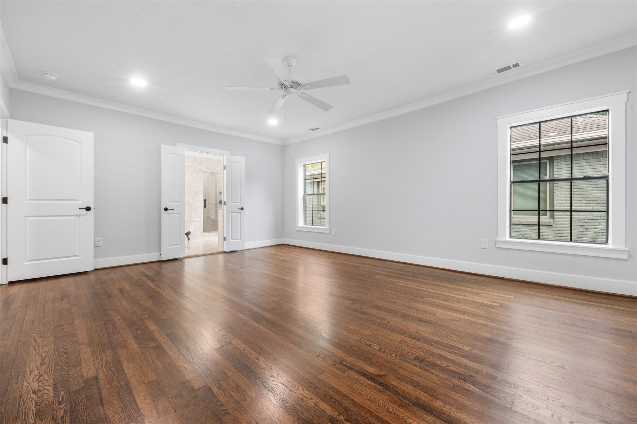 1723 Albans Road Houston, TX 77005 - Photo 24 of 50 an empty room with wooden floor and windows