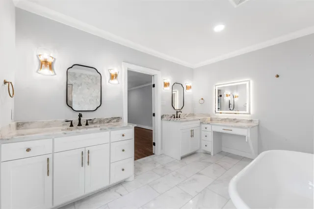 a bathroom with a granite countertop sink mirror and bathtub