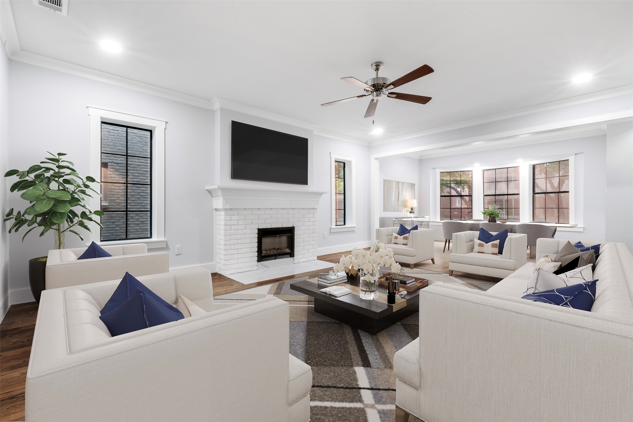 1723 Albans Road Houston, TX 77005 - Photo 3 of 50 a living room with furniture a fireplace and a flat screen tv