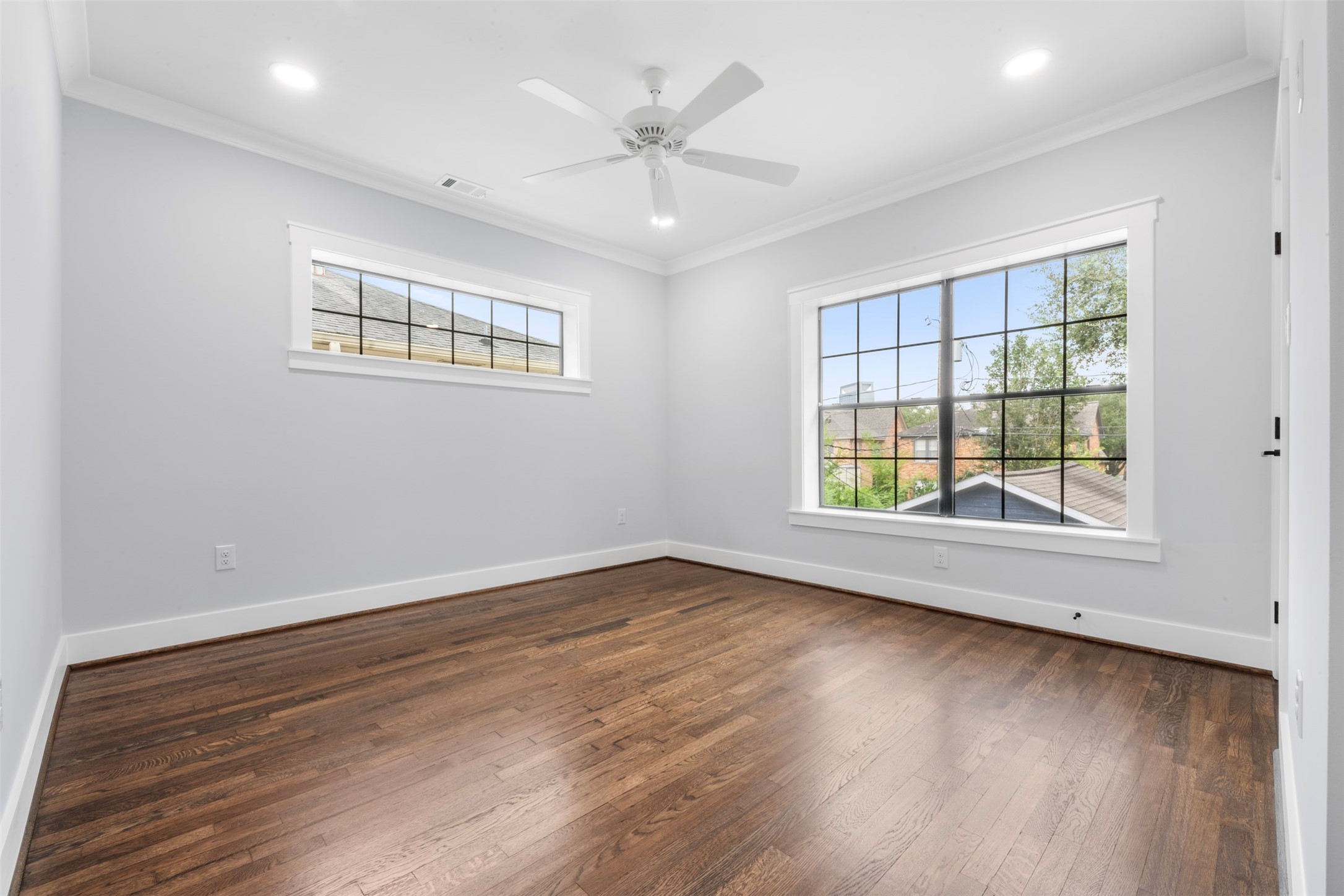 1723 Albans Road Houston, TX 77005 - Photo 31 of 50 an empty room with wooden floor and windows