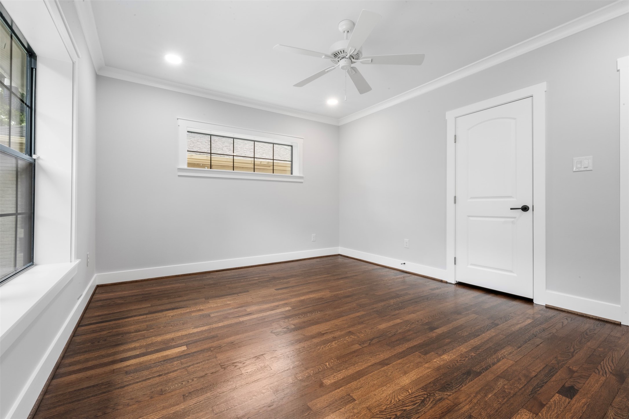 1723 Albans Road Houston, TX 77005 - Photo 34 of 50 a view of an empty room with wooden floor and a window