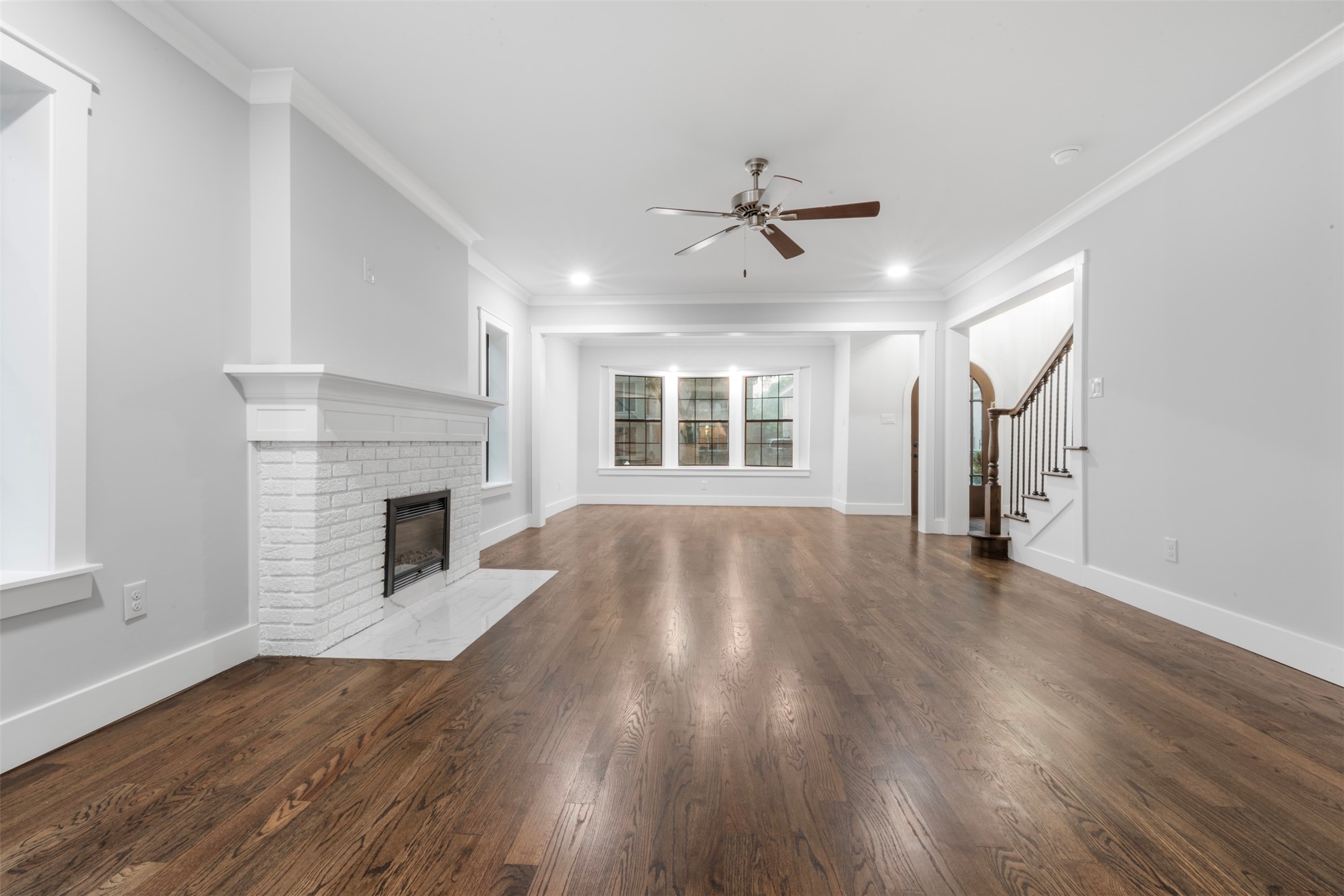 1723 Albans Road Houston, TX 77005 - Photo 4 of 50 a view of empty room with wooden floor and fireplace