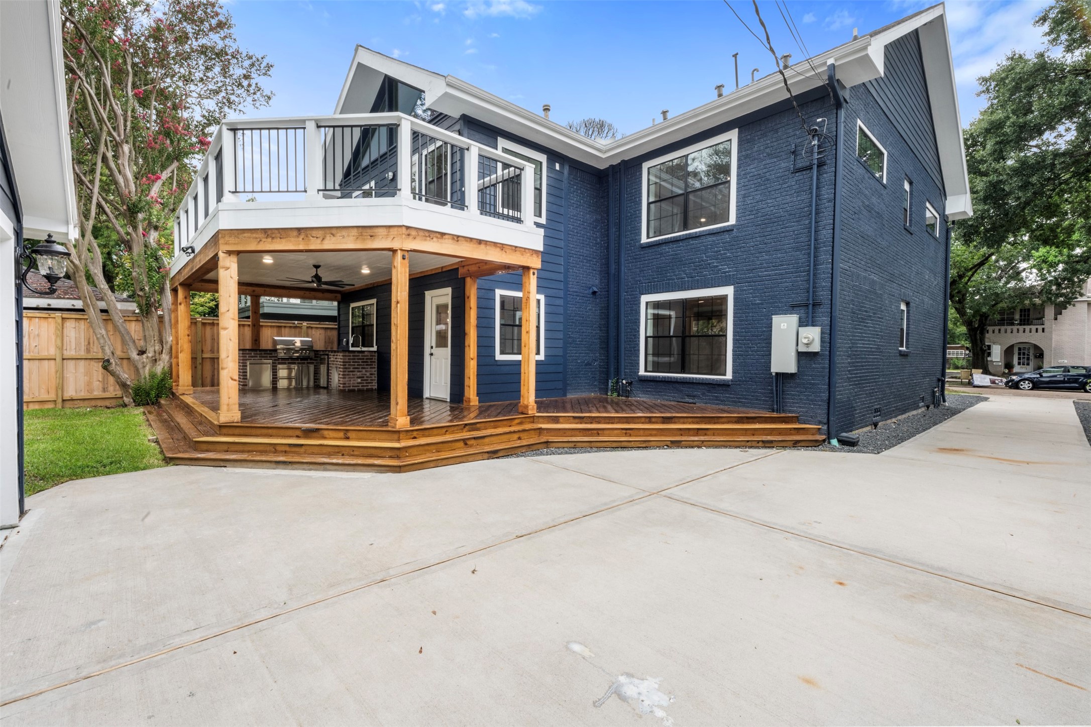 1723 Albans Road Houston, TX 77005 - Photo 46 of 50 a front view of a house with glass windows and yard