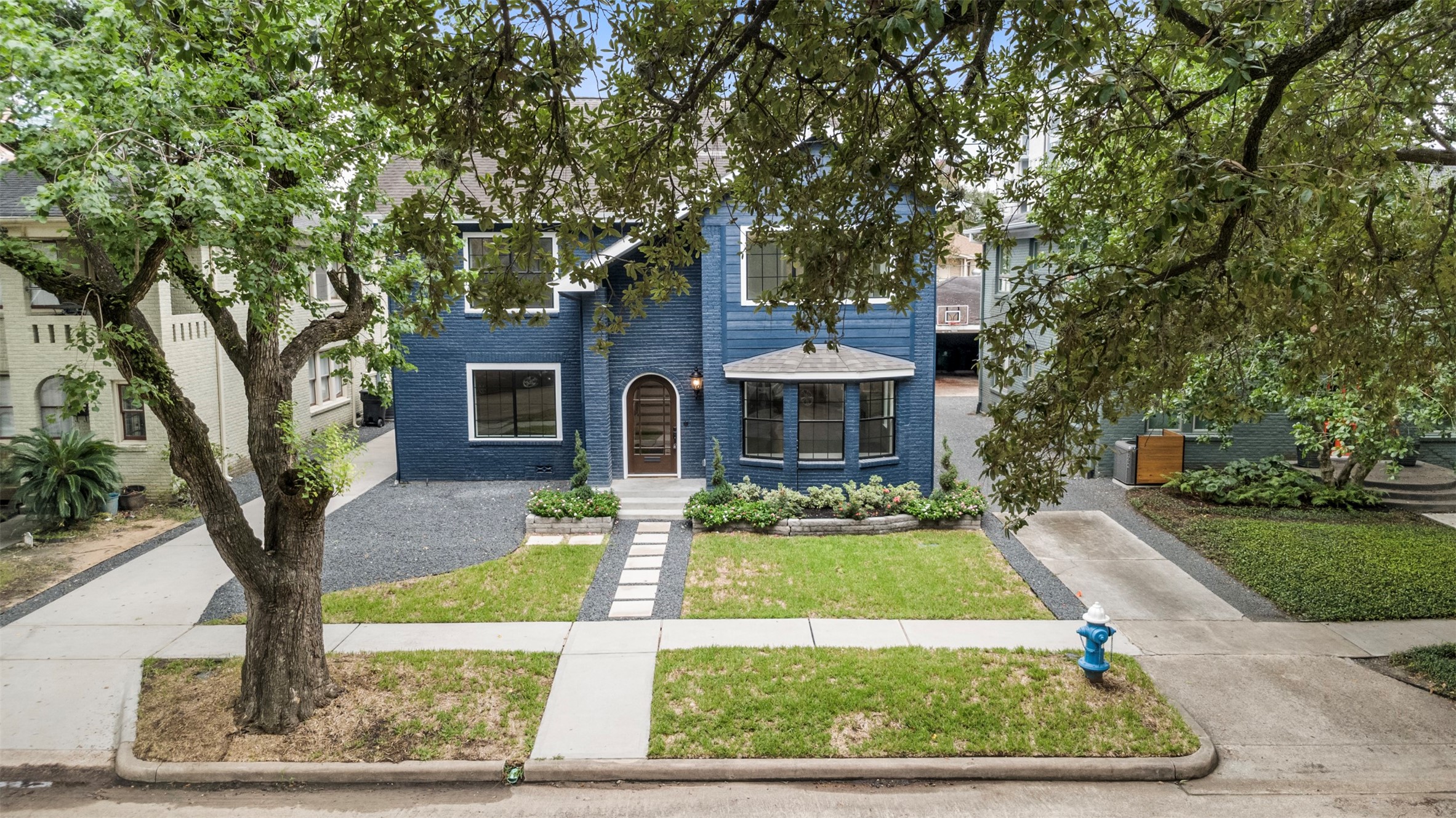 1723 Albans Road Houston, TX 77005 - Photo 48 of 50 a front view of a house with garden