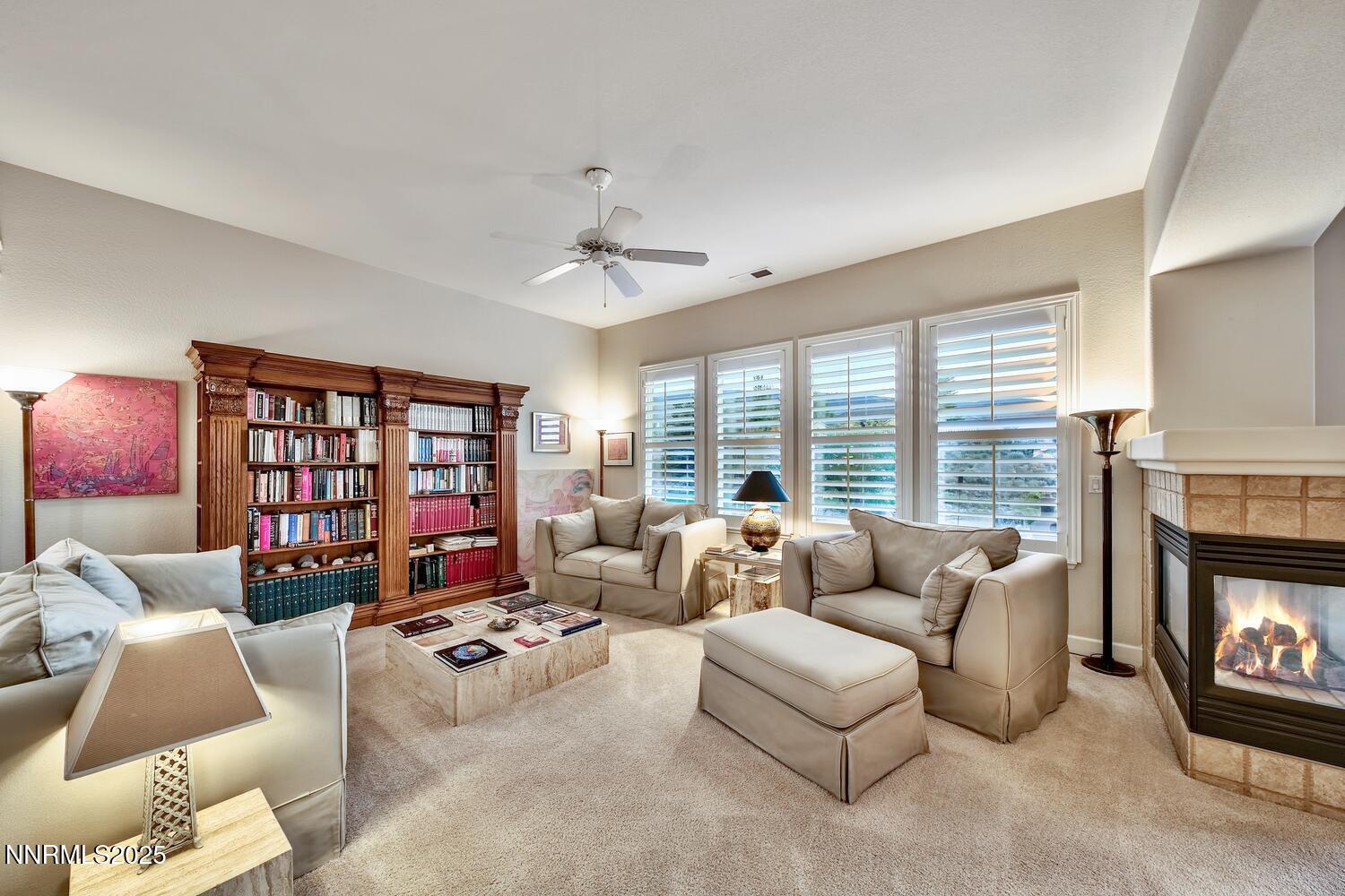5710 North White Sands Road Reno, NV 89511 - Photo 14 of 35 a living room with furniture fireplace and a large window