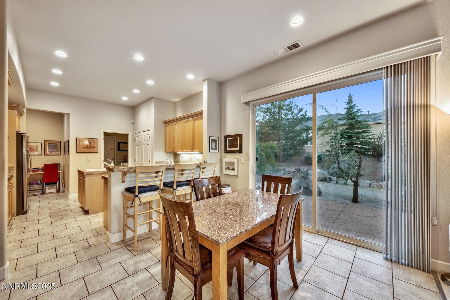 5710 North White Sands Road Reno, NV 89511 - Photo 16 of 35 a view of a dining room with furniture window and outside view