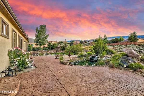 a view of a pathway with a house in the background