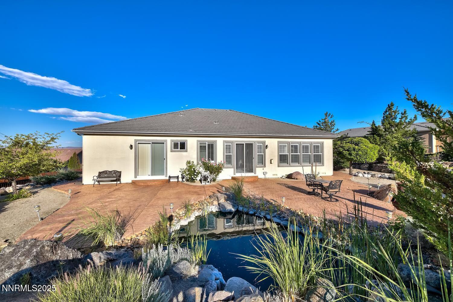 5710 North White Sands Road Reno, NV 89511 - Photo 30 of 35 a view of a house with backyard and sitting area