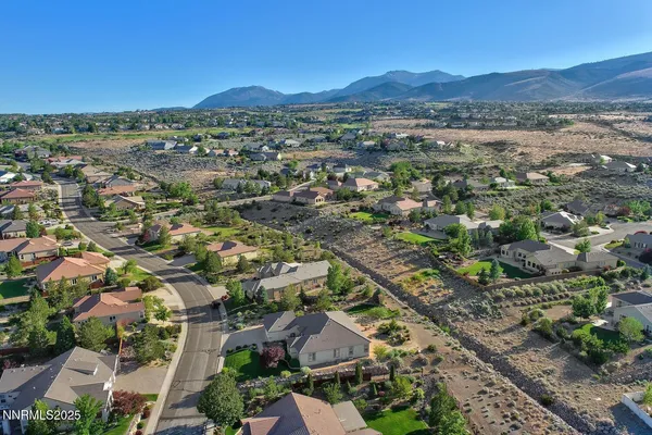 an aerial view of residential houses and outdoor space