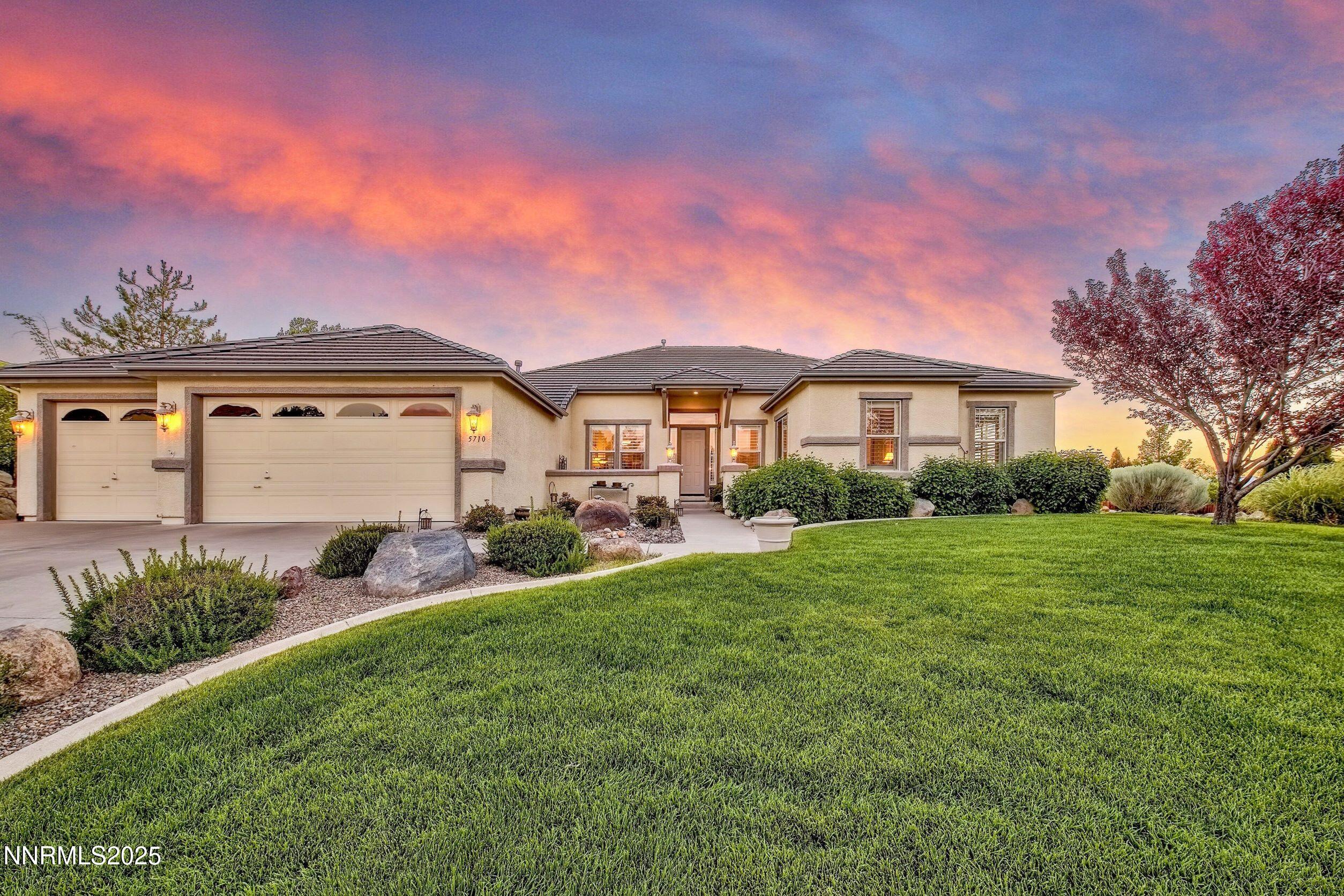 5710 North White Sands Road Reno, NV 89511 - Photo 4 of 35 a front view of a house with garden