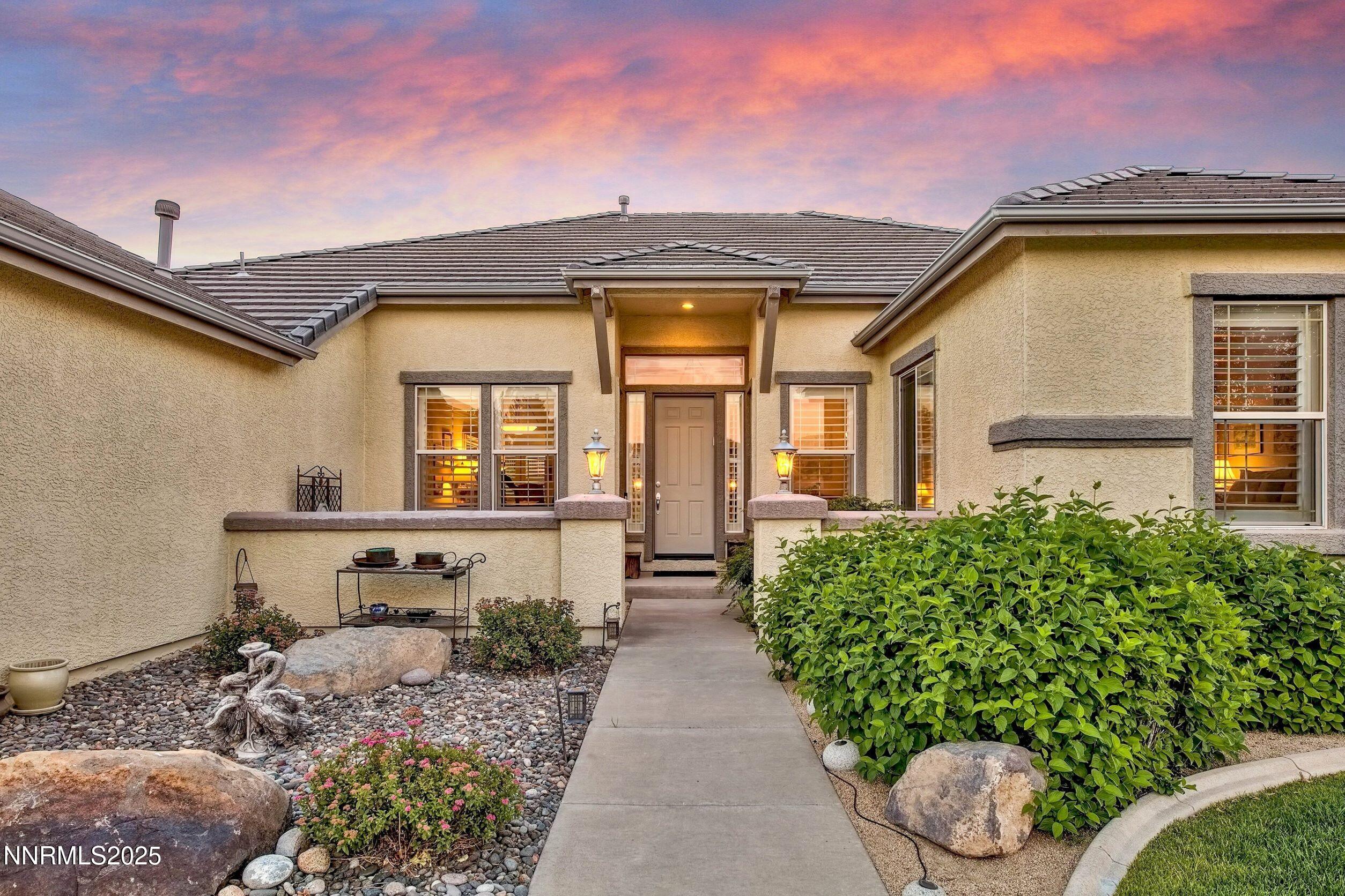 5710 North White Sands Road Reno, NV 89511 - Photo 5 of 35 a front view of a house with garden