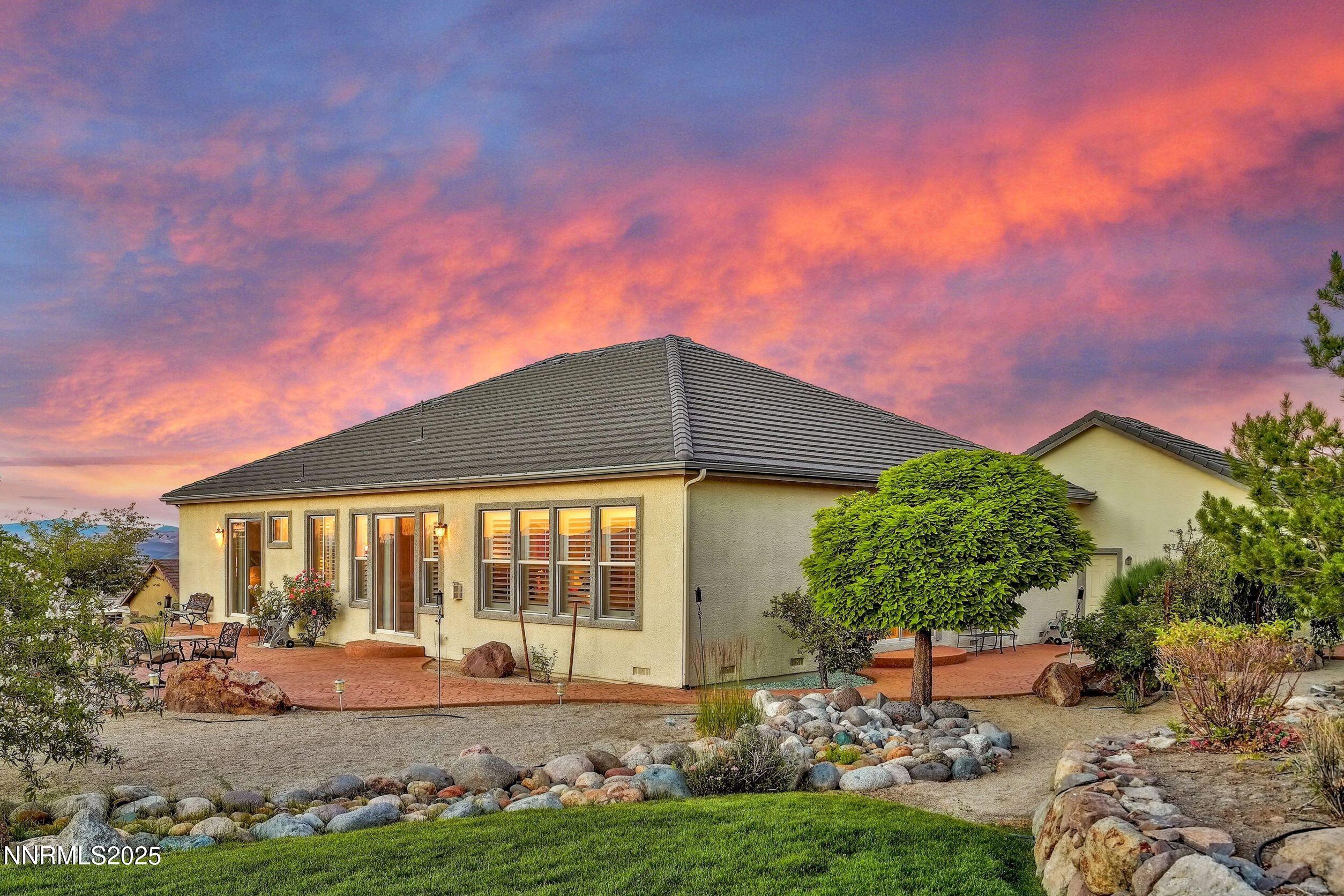 5710 North White Sands Road Reno, NV 89511 - Photo 6 of 35 a house view with a garden space