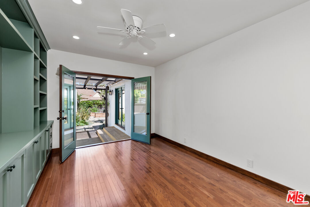 1039 Hi Point Street Los Angeles, CA 90035 - Photo 13 of 27 a view of a livingroom with furniture hardwood floor and a large window