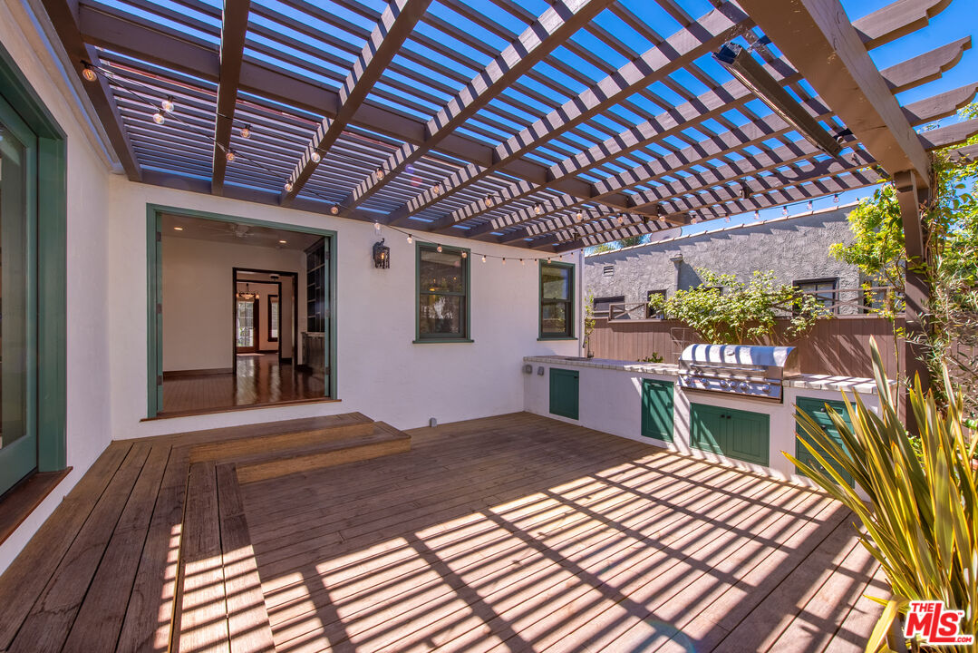 1039 Hi Point Street Los Angeles, CA 90035 - Photo 18 of 27 a bedroom with a bed and a table