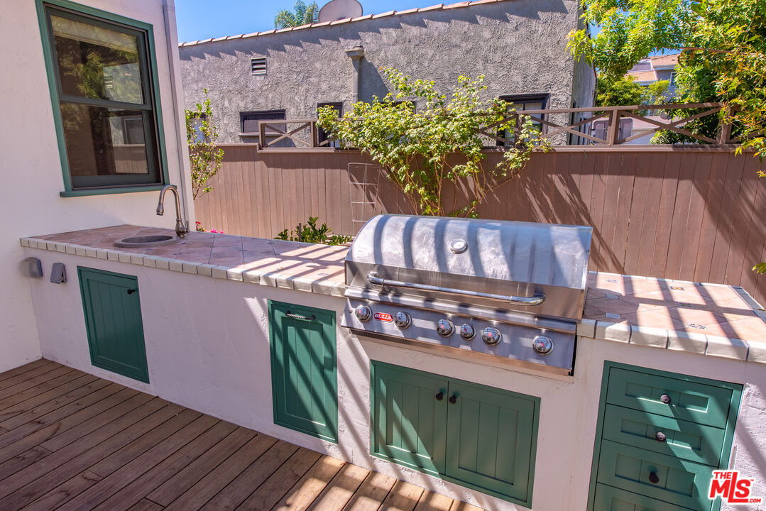1039 Hi Point Street Los Angeles, CA 90035 - Photo 19 of 27 a view of a chairs and table on the wooden floor