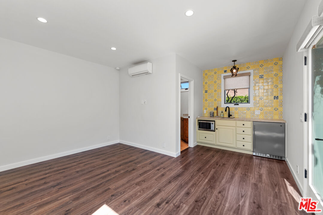 1039 Hi Point Street Los Angeles, CA 90035 - Photo 23 of 27 a view of a kitchen with wooden floor