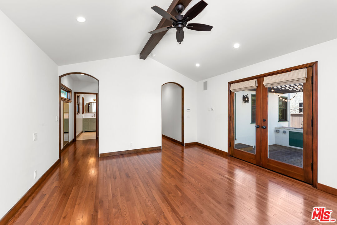 1039 Hi Point Street Los Angeles, CA 90035 - Photo 10 of 27 a view of empty room with wooden floor and fan