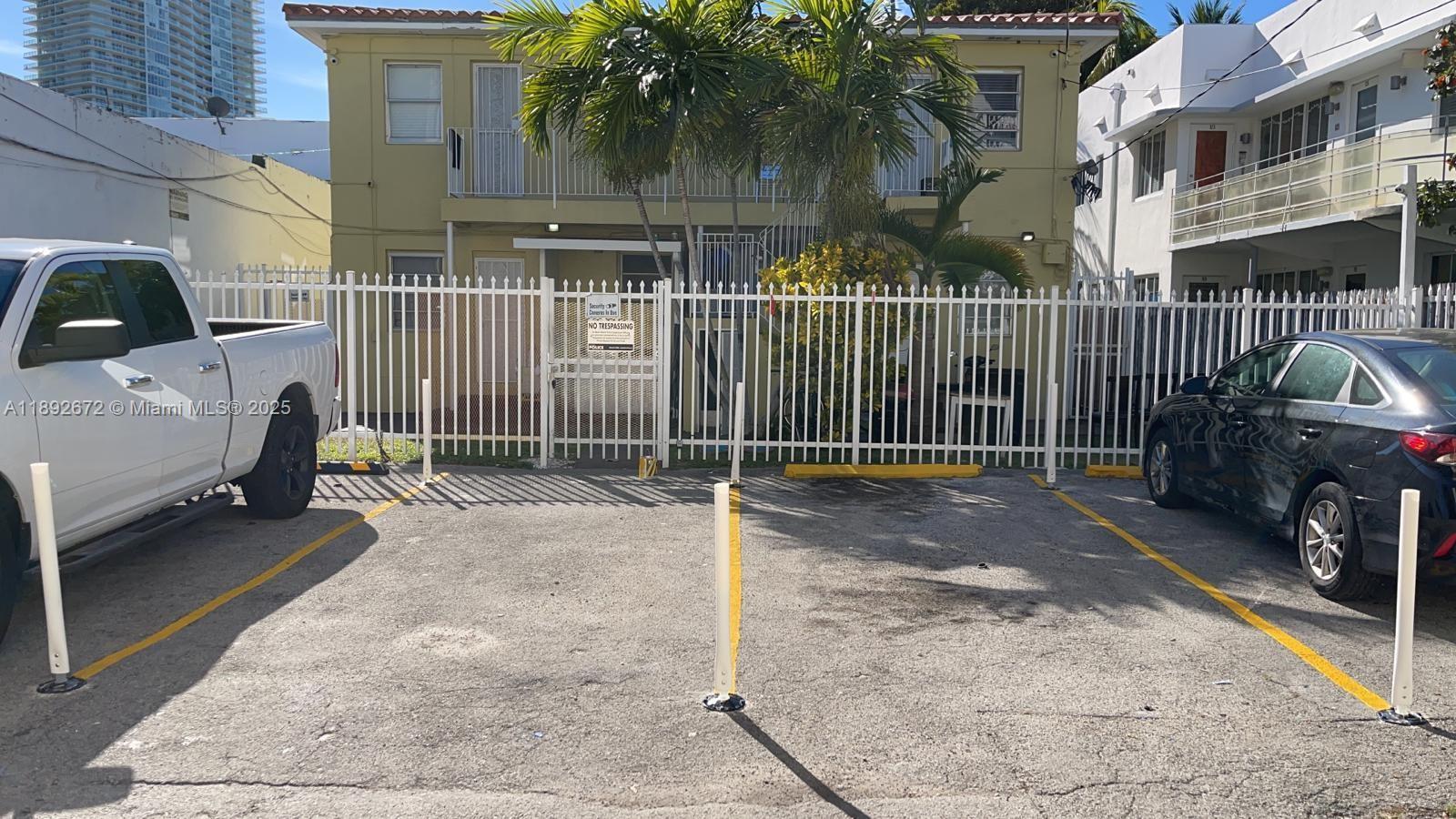 545 Michigan Avenue, Unit 6 Miami Beach, FL 33139 - Photo 13 of 13 a view of a house with a sink and wooden fence