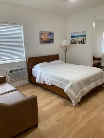 a bedroom with a bed and a cabinets