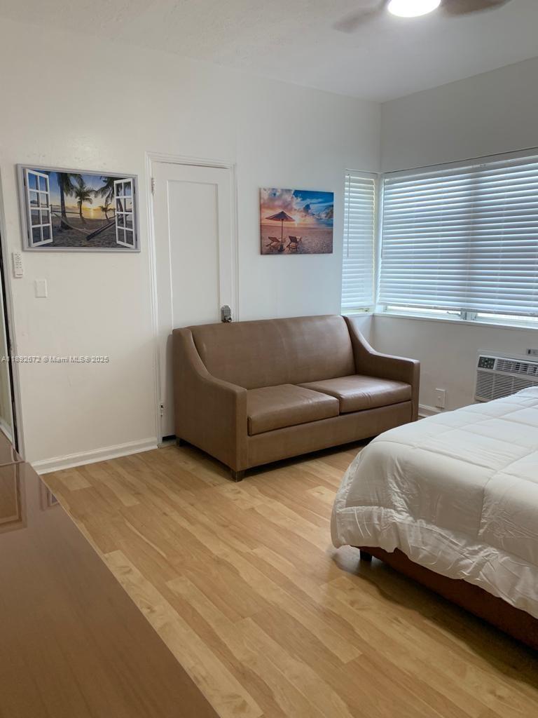 545 Michigan Avenue, Unit 6 Miami Beach, FL 33139 - Photo 10 of 13 a living room with couches and painting on the wall
