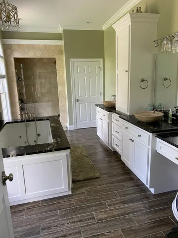 a kitchen with stainless steel appliances granite countertop a stove and a sink
