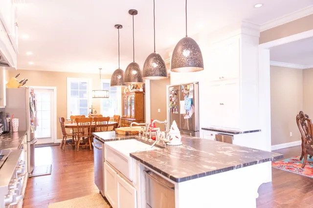 a dining table seating space with furniture and wooden floor