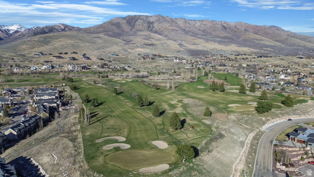 3598 North Huntsman Path, Unit 502 Eden, UT 84310 - Photo 31 of 43 Aerial perspective of suburban area with a mountainous background and a golf club