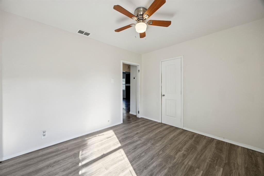 3228 Emmett Street Dallas, TX 75211 - Photo 12 of 25 a view of empty room with wooden floor