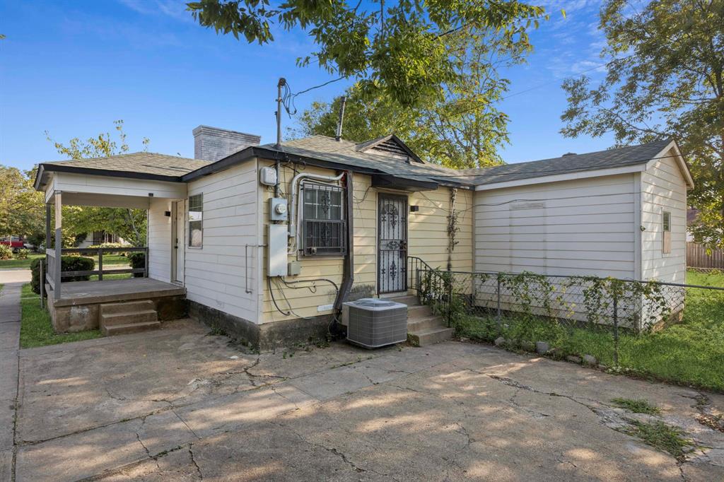 3228 Emmett Street Dallas, TX 75211 - Photo 2 of 25 a view of a chair and table in backyard of the house
