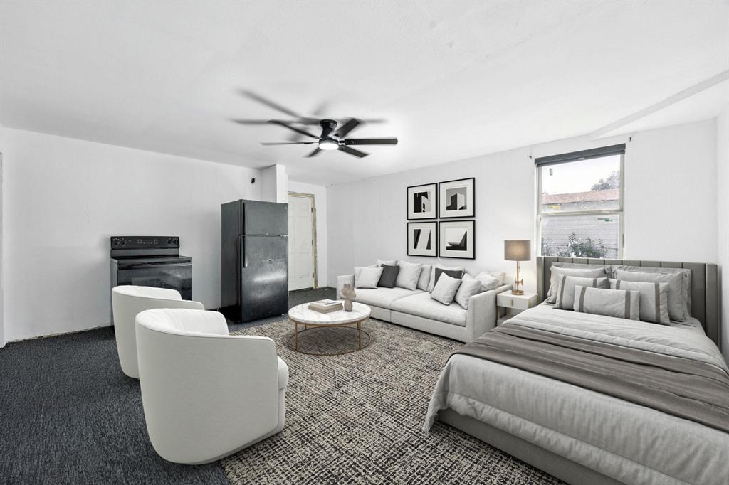 3228 Emmett Street Dallas, TX 75211 - Photo 22 of 25 a living room with furniture and a wooden floor