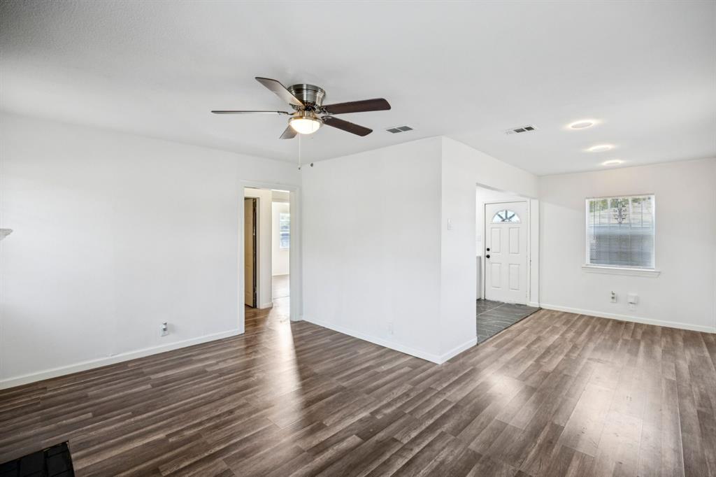 3228 Emmett Street Dallas, TX 75211 - Photo 5 of 25 a view of empty room with wooden floor