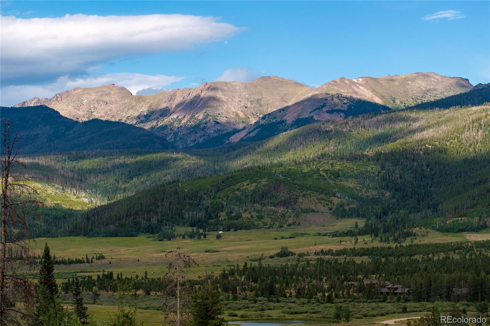 a view of a town with mountains in the background
