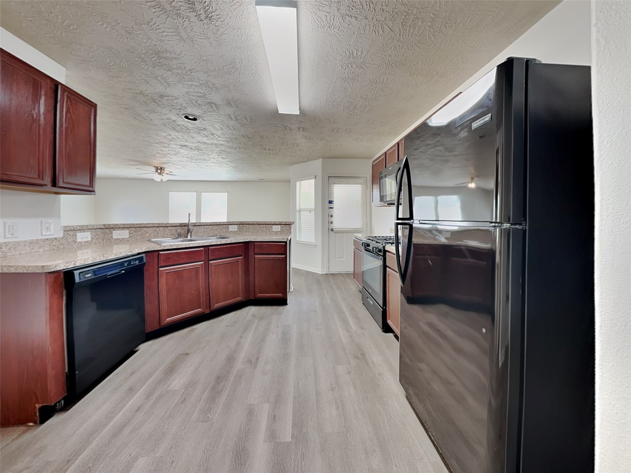 3406 Maris Way Humble, TX 77338 - Photo 2 of 19 a large kitchen with stainless steel appliances granite countertop a refrigerator and a sink