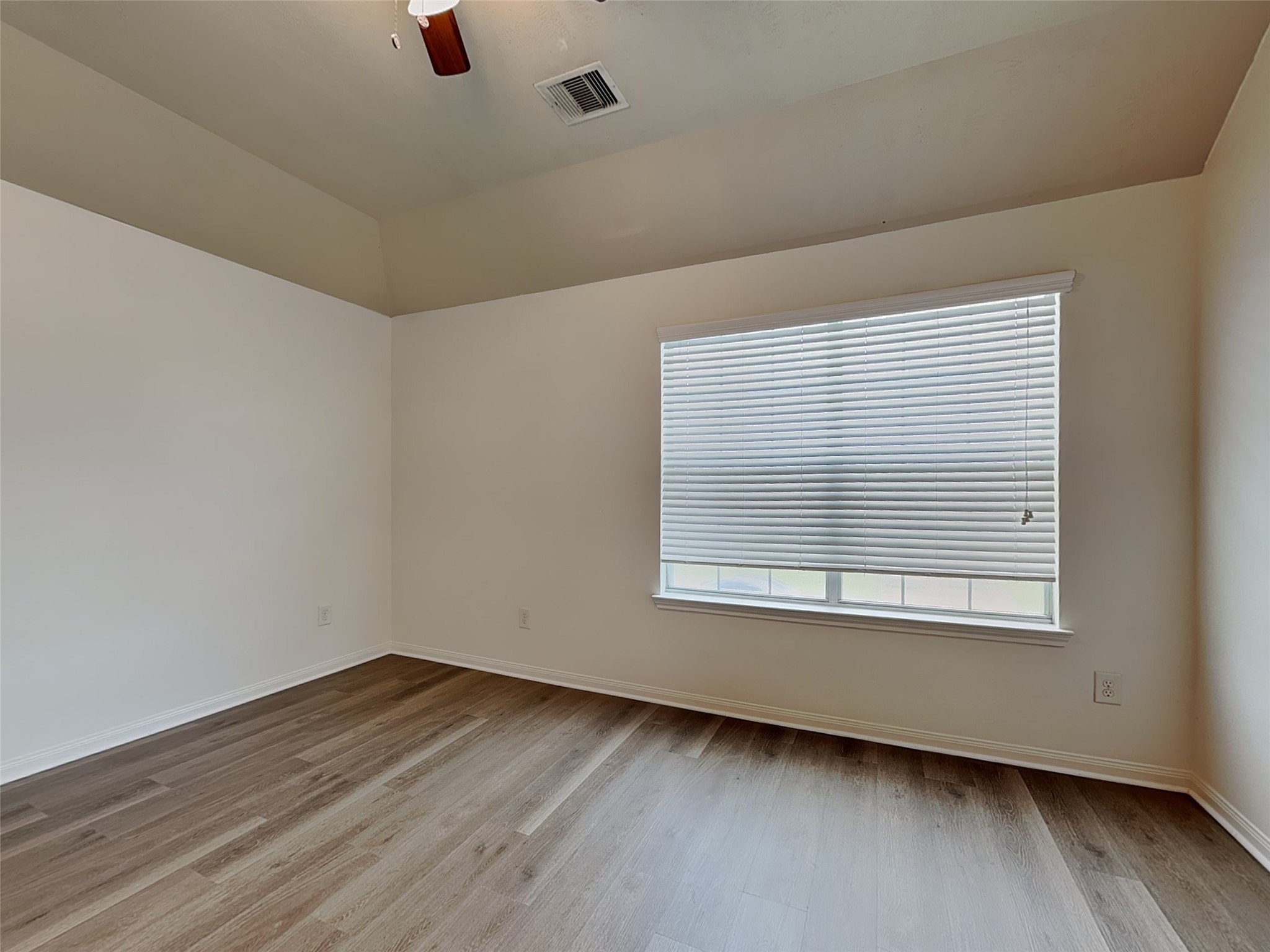 3406 Maris Way Humble, TX 77338 - Photo 8 of 19 an empty room with wooden floor and windows