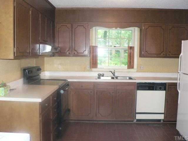 305 Blaine Court Raleigh, NC 27609 - Photo 2 of 7 Kitchen is next to dining room.