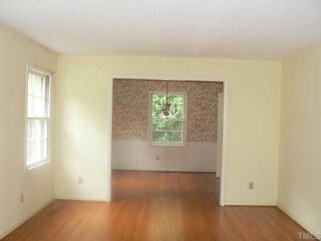 305 Blaine Court Raleigh, NC 27609 - Photo 3 of 7 Large living room next to dining room.