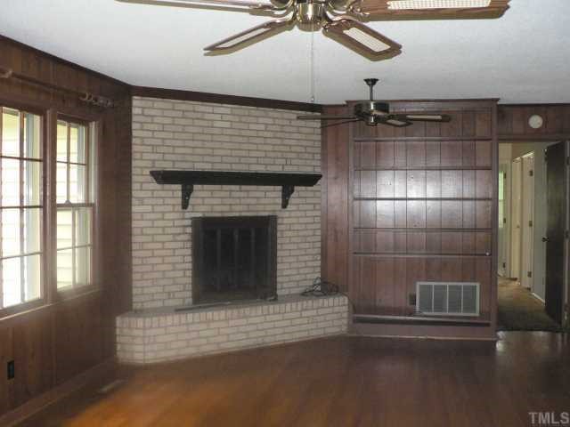 305 Blaine Court Raleigh, NC 27609 - Photo 4 of 7 Family room has a masonry fireplace.