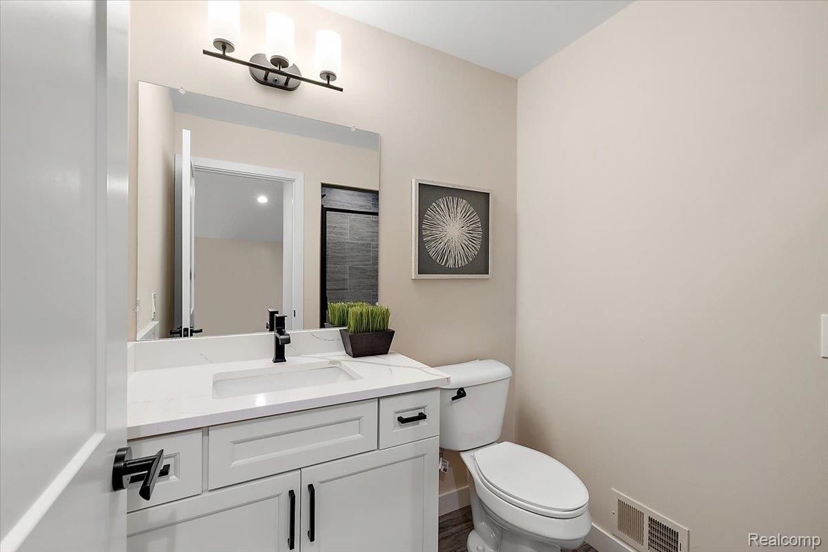 2032 Breckenridge Court, Unit 9 Rochester, MI 48309 - Photo 36 of 39 Bathroom with vanity and toilet