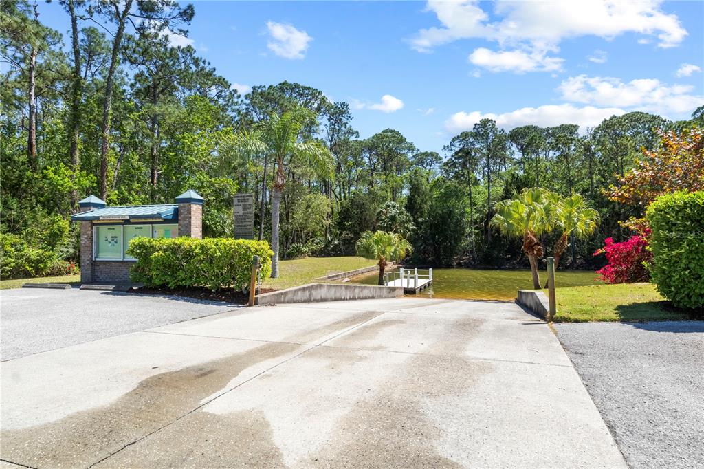 3336 Croaker Drive, Unit LOT 36 Hernando Beach, FL 34607 - Photo 11 of 20 a view of backyard with swimming pool and seating space