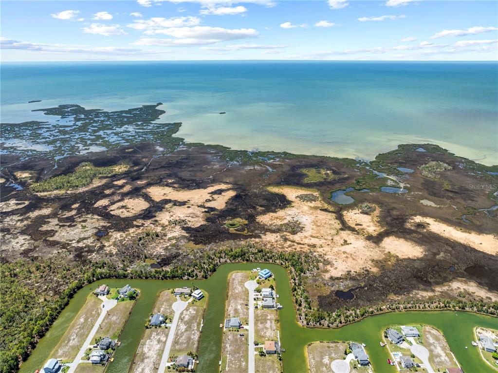 3336 Croaker Drive, Unit LOT 36 Hernando Beach, FL 34607 - Photo 2 of 20 a view of lake with beach
