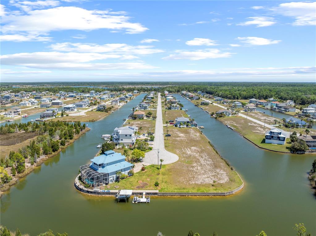3336 Croaker Drive, Unit LOT 36 Hernando Beach, FL 34607 - Photo 7 of 20 a view of a city with an ocean